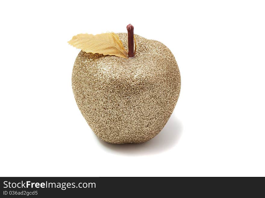 Golden apple shining on a white background