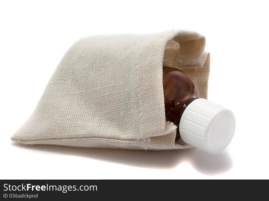 Medicine in the rough gray bag on white background. Medicine in the rough gray bag on white background