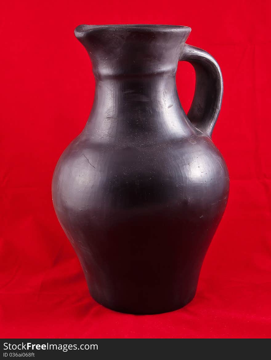 Black jug on red