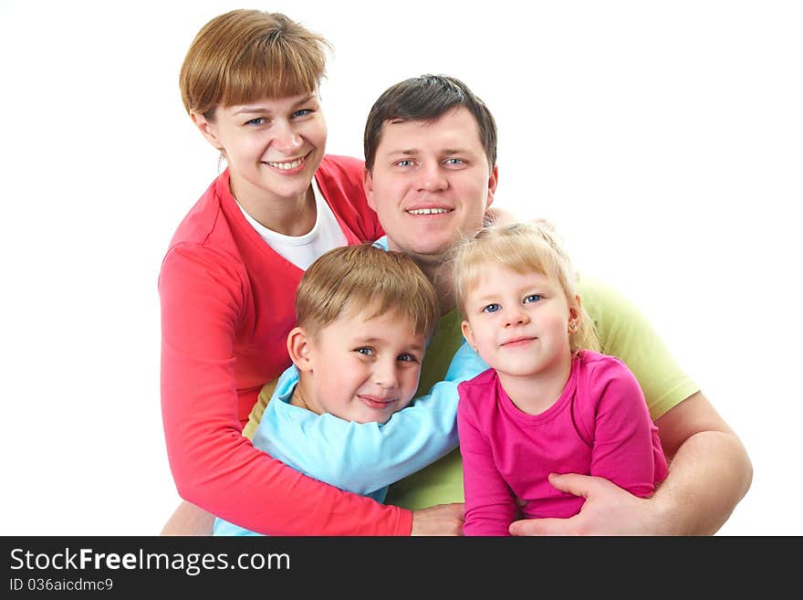 Portrait of siblings and their parents looking at camera. Portrait of siblings and their parents looking at camera