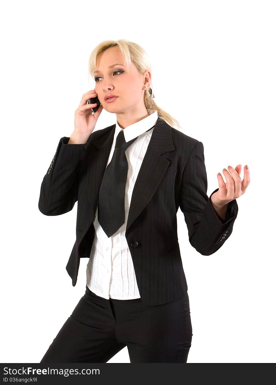 Girl in a business suit gestures while talking on a cell phone. Girl in a business suit gestures while talking on a cell phone.