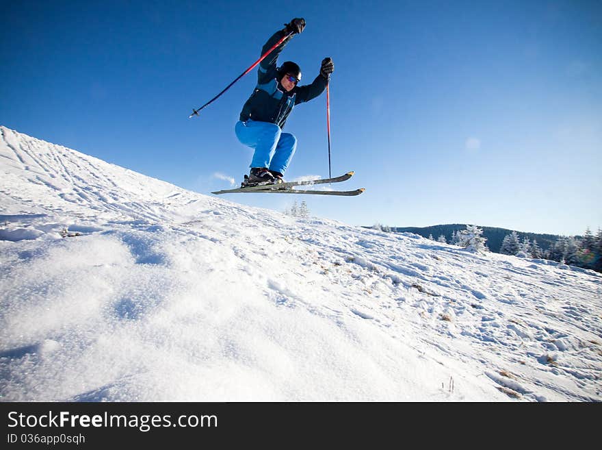 Man practising extreme ski on sunny day