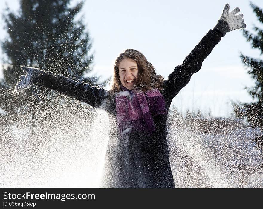 Happy Young Woman In  Snowfall