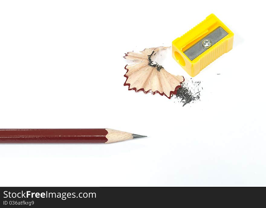 Isolated sharpened pencil and shavings