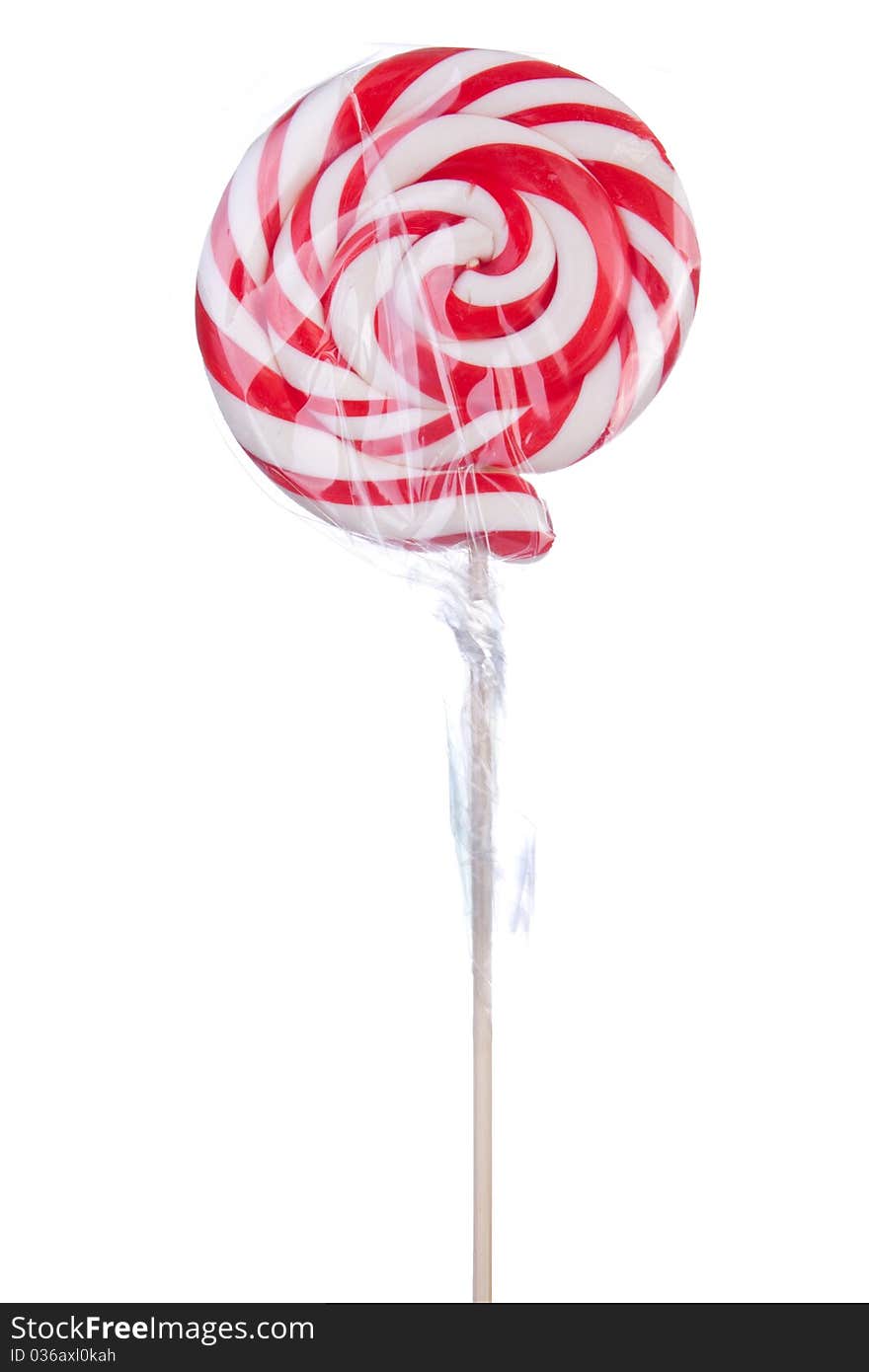 Lovely lollipop with red and white stripes on white background. Lovely lollipop with red and white stripes on white background