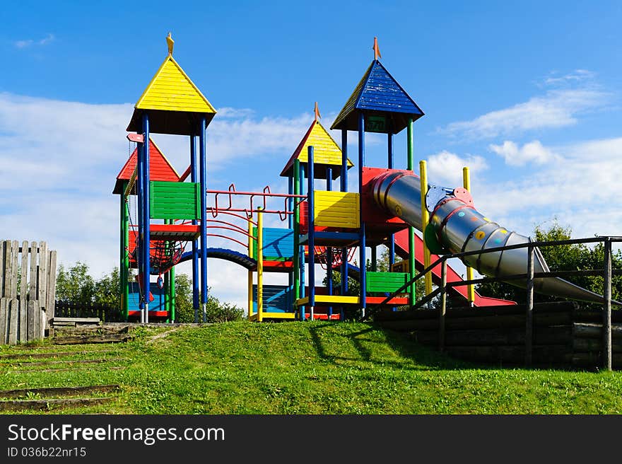 Colorful empty outdoor playground with big slide. Colorful empty outdoor playground with big slide