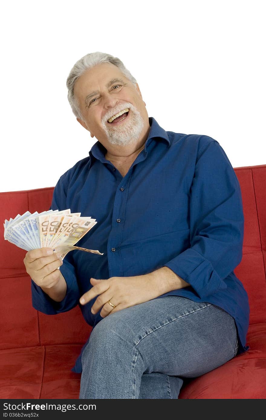 Elderly man on the couch with money in hand in a white background