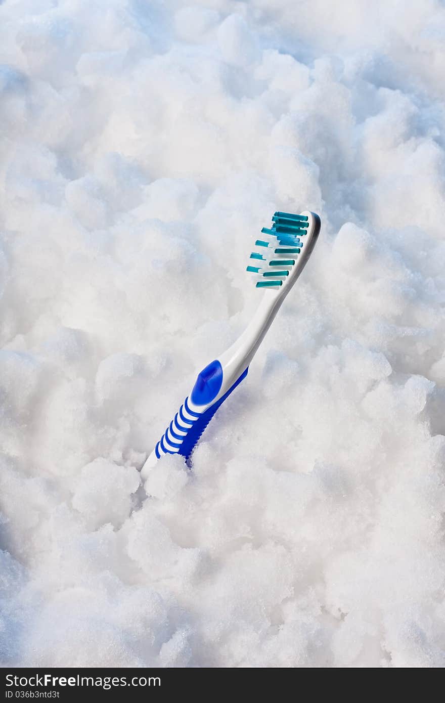 Blue Toothbrush on a snow