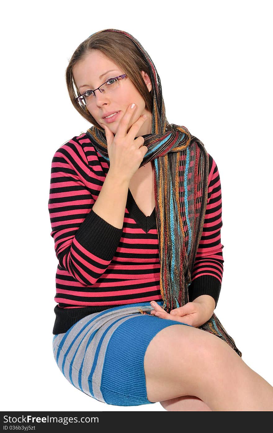 Portrait of a girl in a striped blouse with a beautiful shawl on her head. Portrait of a girl in a striped blouse with a beautiful shawl on her head