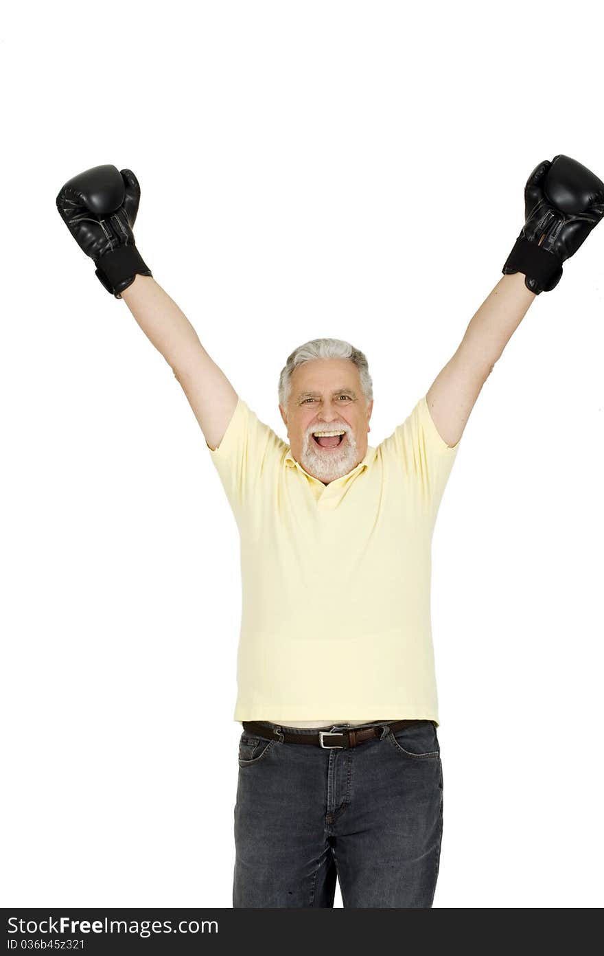 Elderly man with boxing gloves in a white background