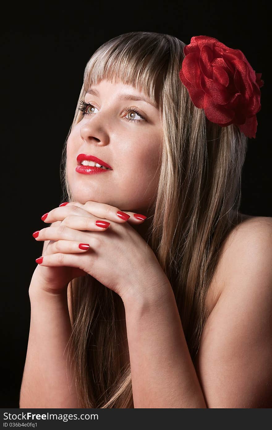 Happy Blond With Red Flower In Hair