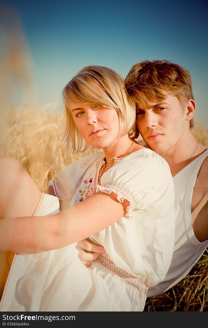 Image Of Young Man And Woman On Wheat Field