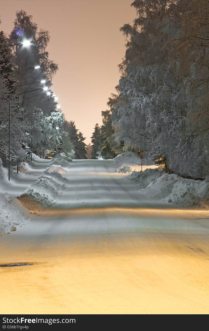 Snovy street at night time.