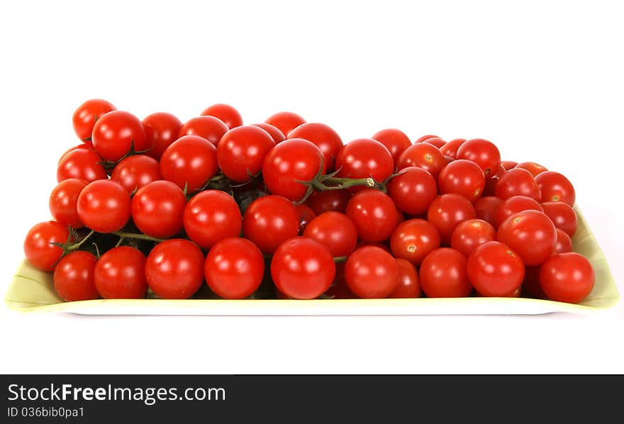 Cherry tomato --is a smaller garden variety of tomato, on a white background