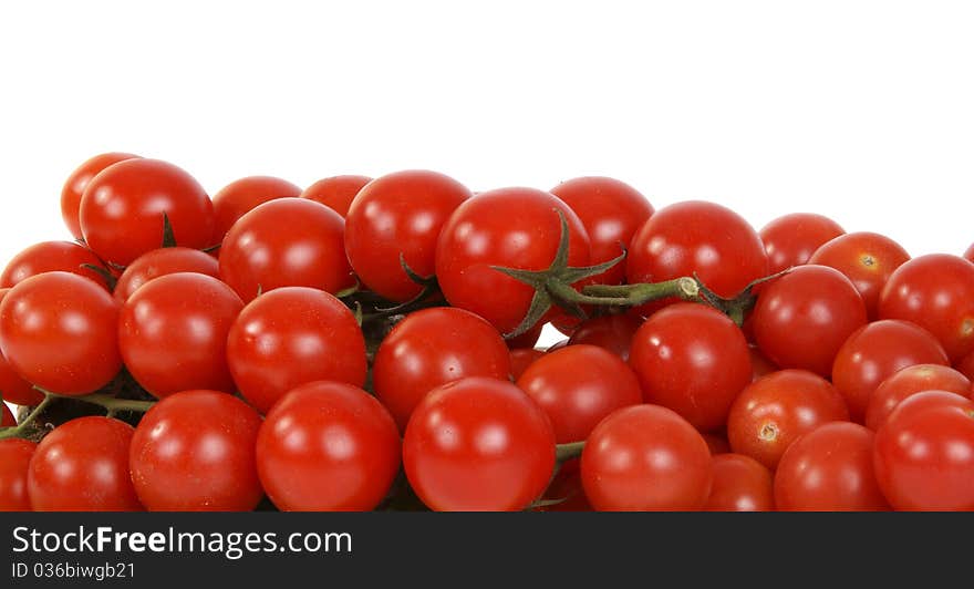 Cherry tomato --is a smaller garden variety of tomato, on a white background