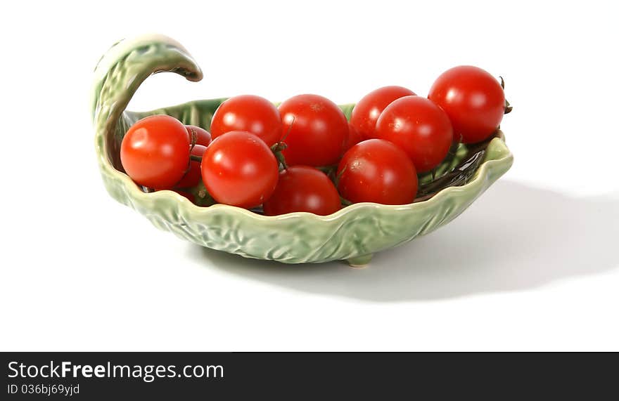 Cherry tomato --is a smaller garden variety of tomato, on a white background