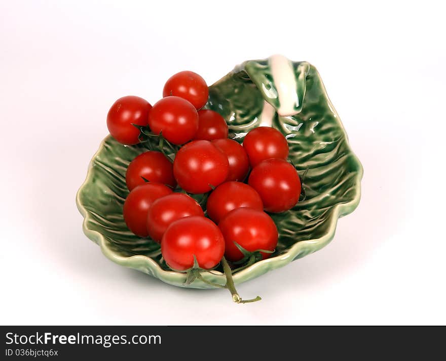 Cherry tomato --is a smaller garden variety of tomato, on a white background