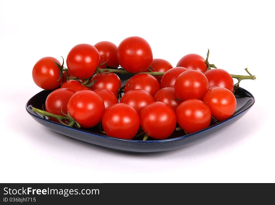 Cherry tomato --is a smaller garden variety of tomato, on a white background