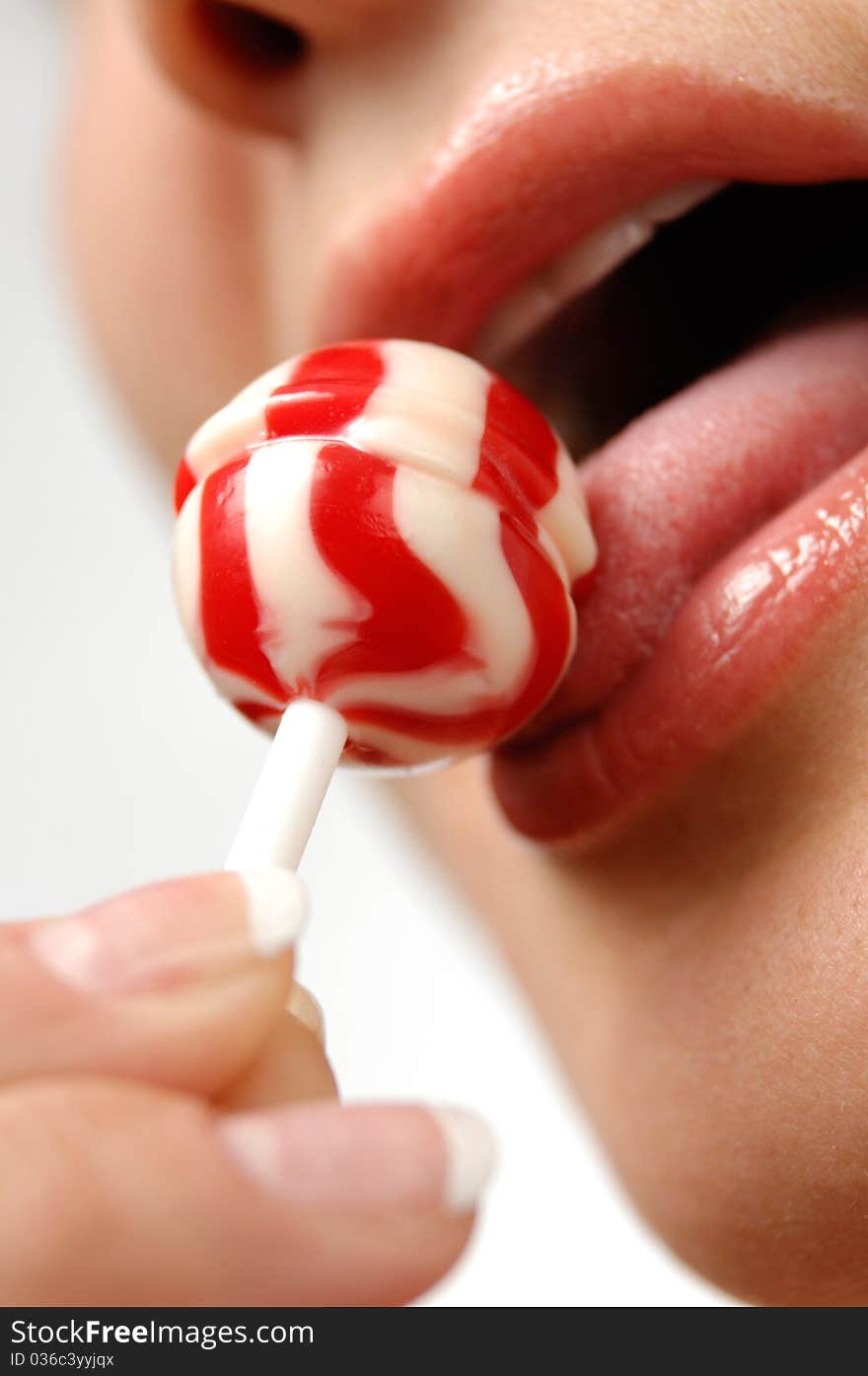 Girl Licking A Lollipop