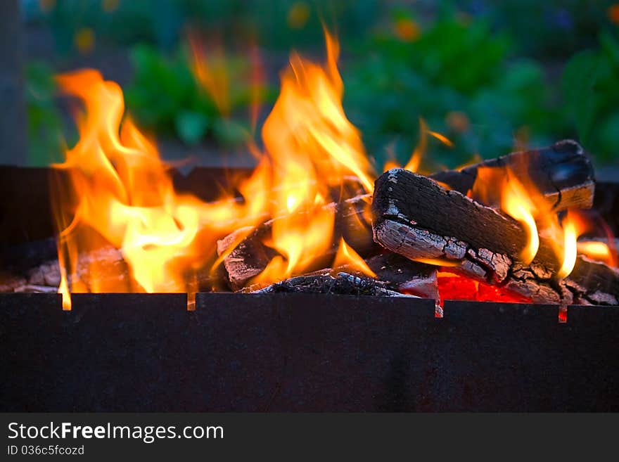 Hot fire and flames on  wood with  close-up.