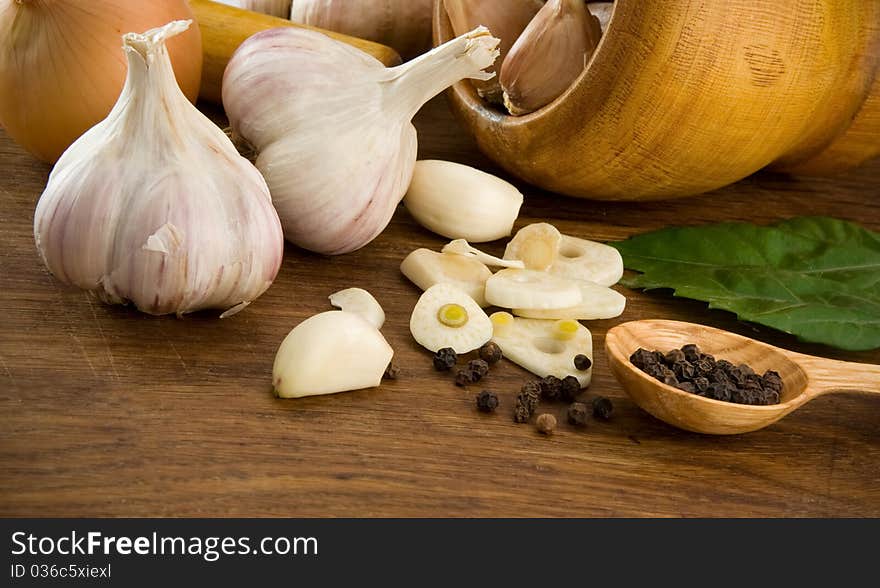 Garlic and healthy food on wooden