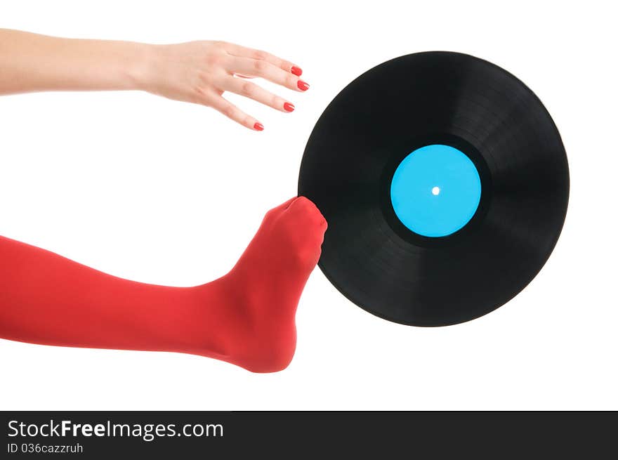 Female feet with vinyl record