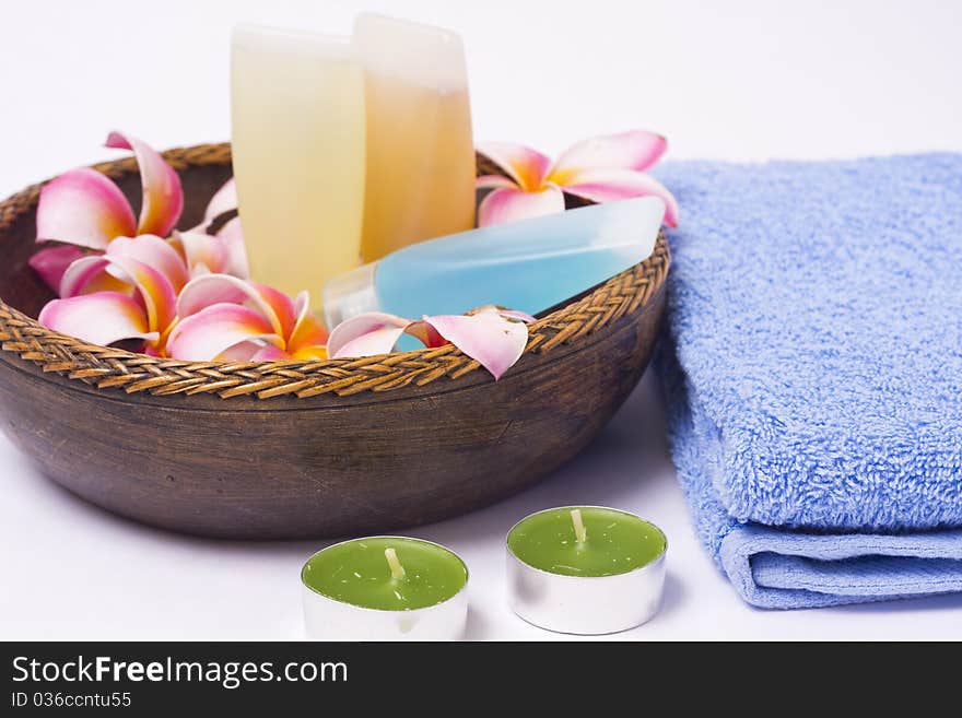 A bath gel and hair shampoo in a wood bowl. A bath gel and hair shampoo in a wood bowl