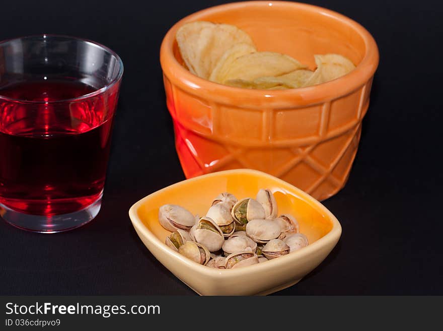 Appetizer chips and pistachios