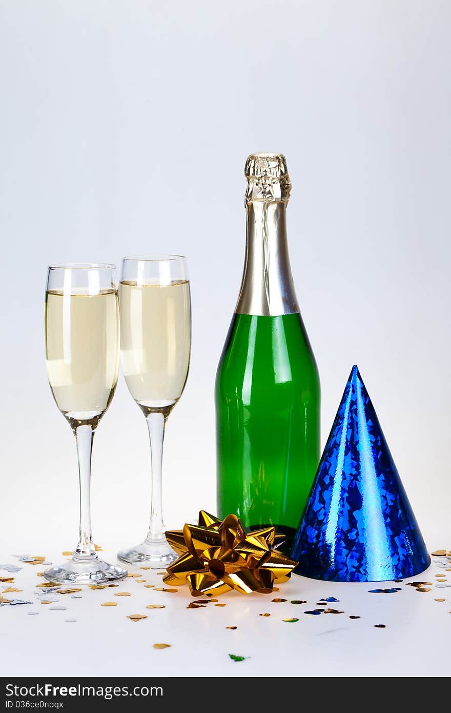 Champagne and glass on the white background. Champagne and glass on the white background.