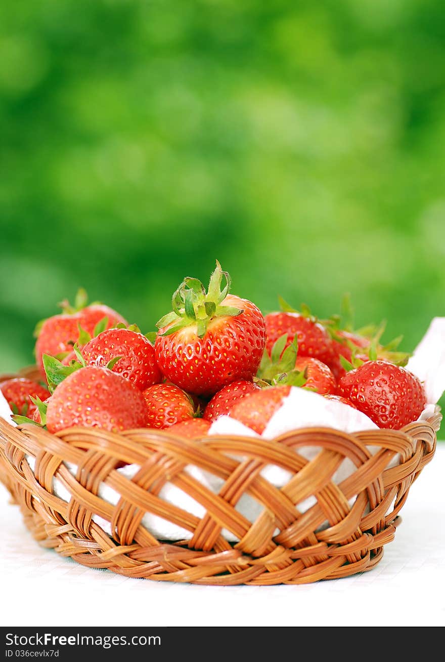 Fresh strawberries against green background. Fresh strawberries against green background