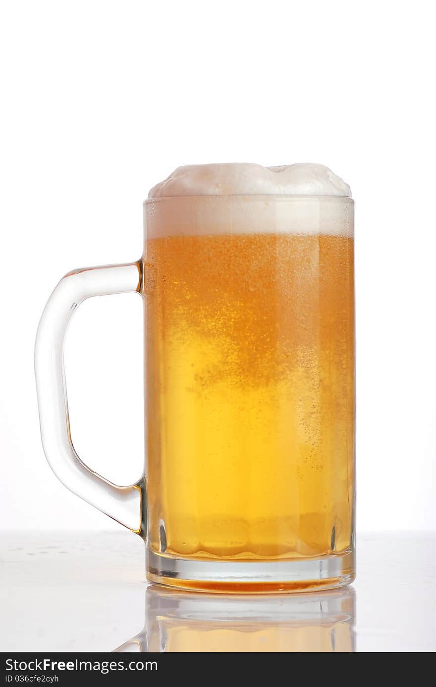 Glass of beer close-up with froth