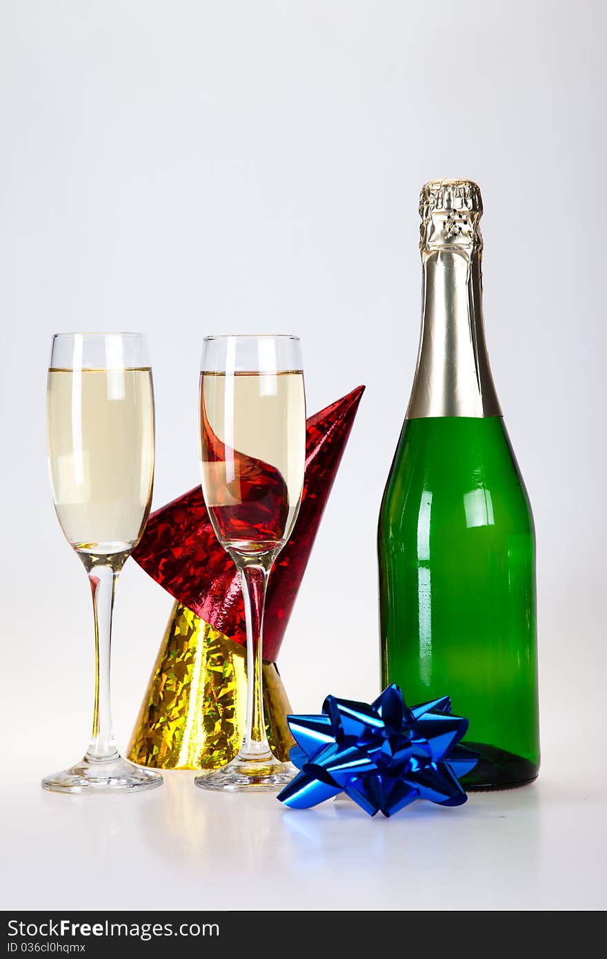 Champagne and glass on the white background. Champagne and glass on the white background.