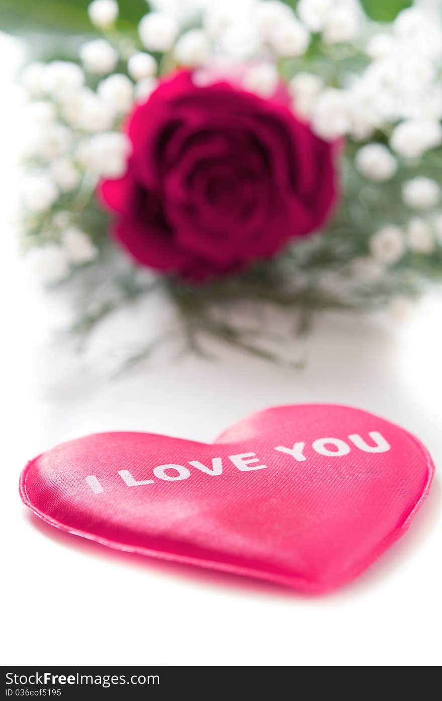 Pink rose with Valentine heart on white. Pink rose with Valentine heart on white