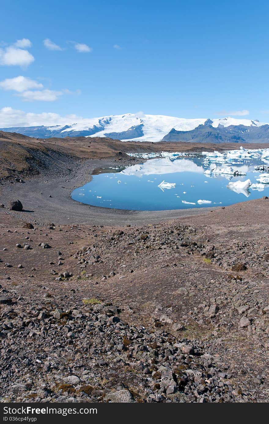 Landscape with iceberg reflections on the Jokulsarlon lake in Iceland