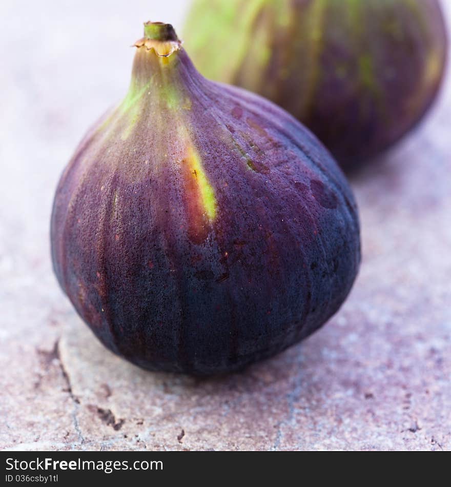 Closeup of ripe figs on a stone background. Closeup of ripe figs on a stone background