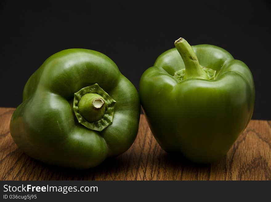 Paprika on kitchen table and black background turns green. Paprika on kitchen table and black background turns green