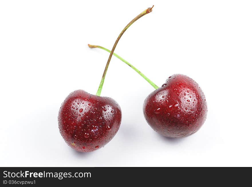 There are two cherry with drop of water. There are two cherry with drop of water