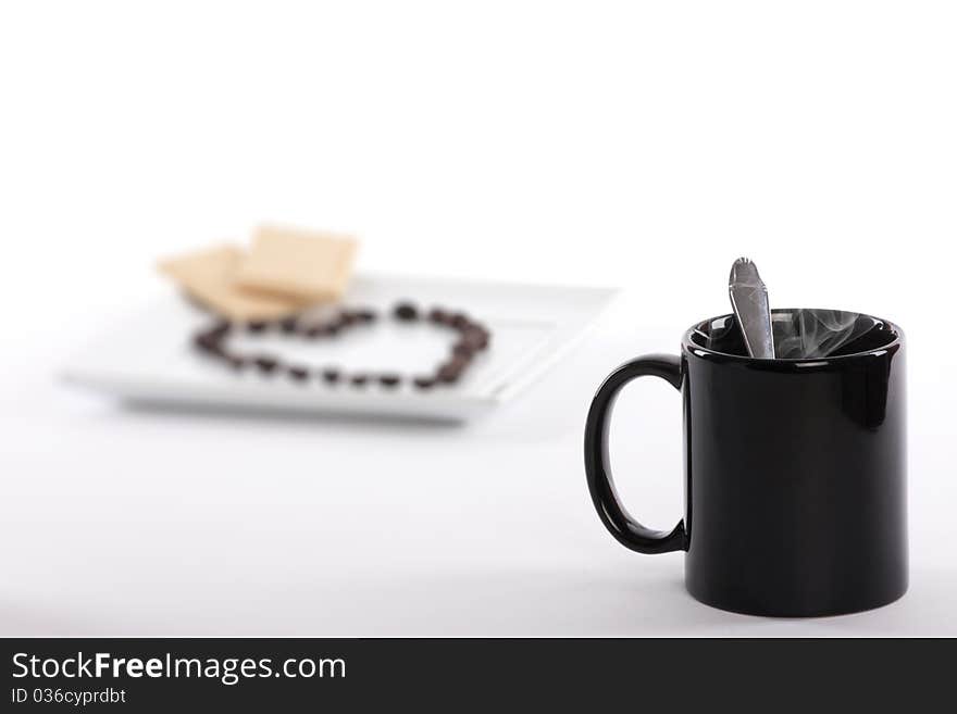 Coffee beans and cup close up. Coffee beans and cup close up