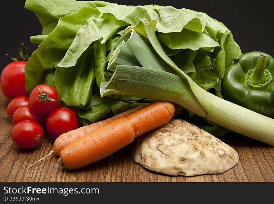 Head lettuce with leek, tomato, carrot and celery. Head lettuce with leek, tomato, carrot and celery