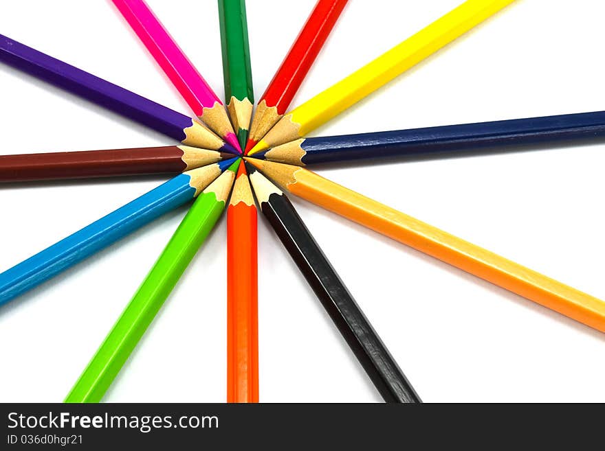 Assortment of coloured pencils on white background. Assortment of coloured pencils on white background