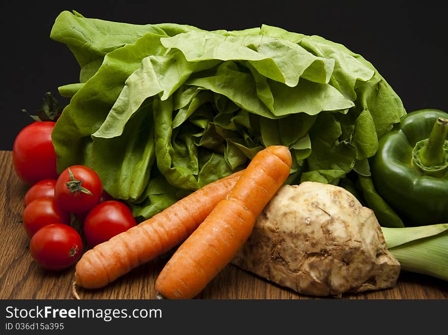 Head lettuce with paprikas, tomato, carrot and celeries. Head lettuce with paprikas, tomato, carrot and celeries