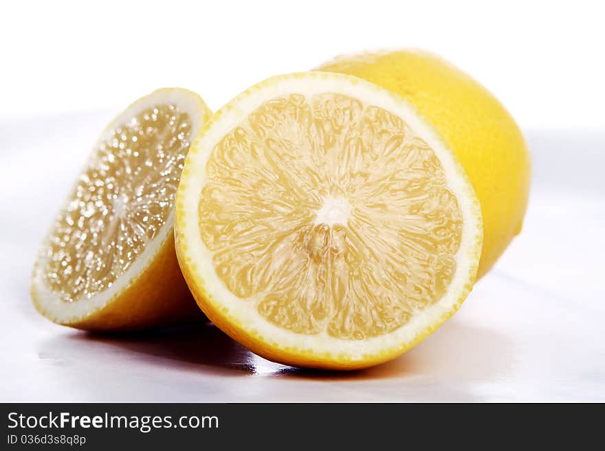 Fresh and wet lemon on white background. Fresh and wet lemon on white background