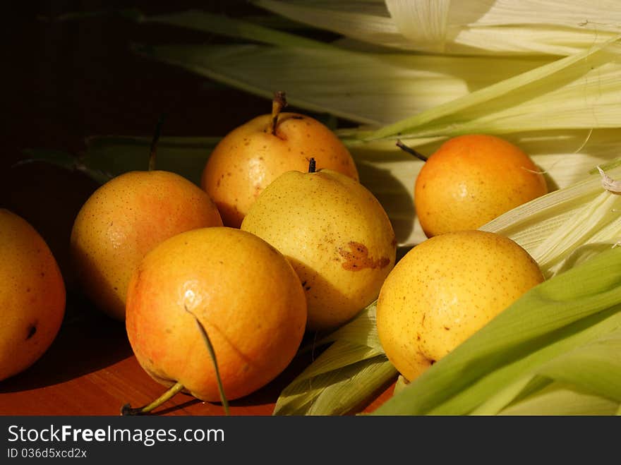 Pears and corn leaves