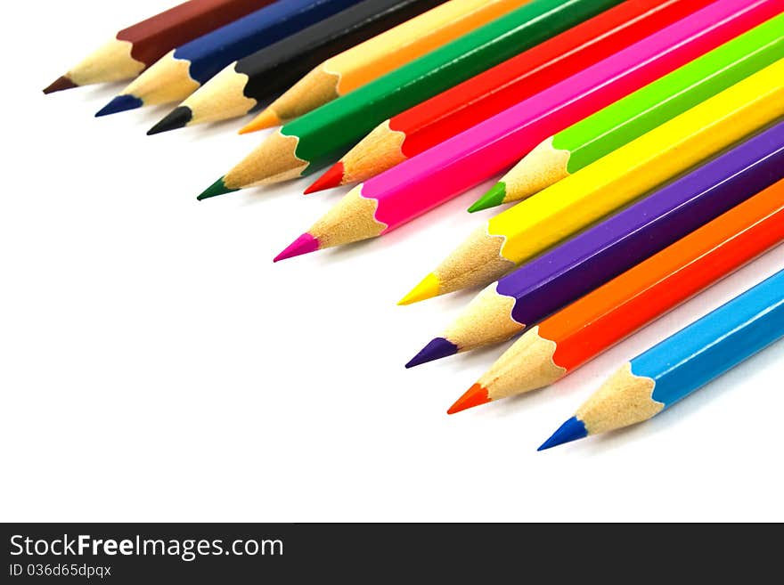 Assortment of coloured pencils on white background. Assortment of coloured pencils on white background