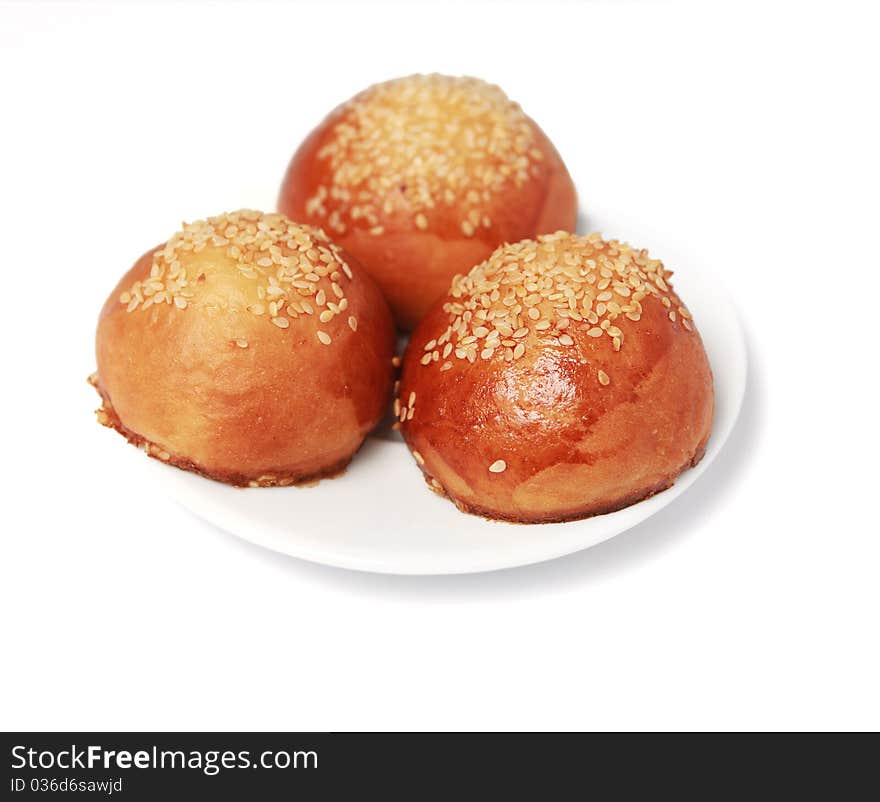 Three just baked loafs on a plate. Three just baked loafs on a plate