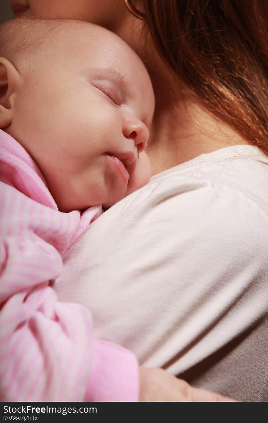 Little baby asleep on mother's chest. Little baby asleep on mother's chest