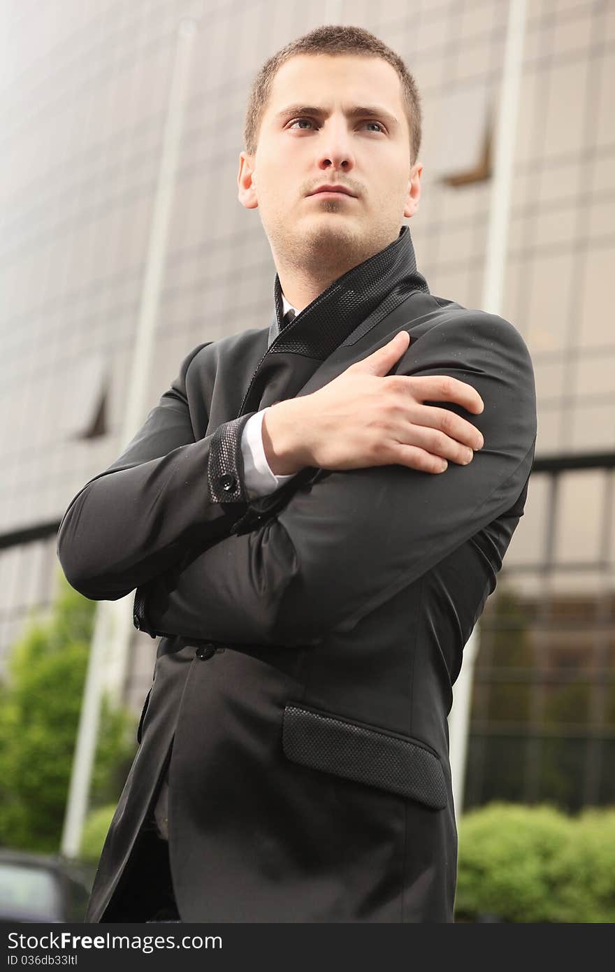 Young student standing near institute building. Young student standing near institute building