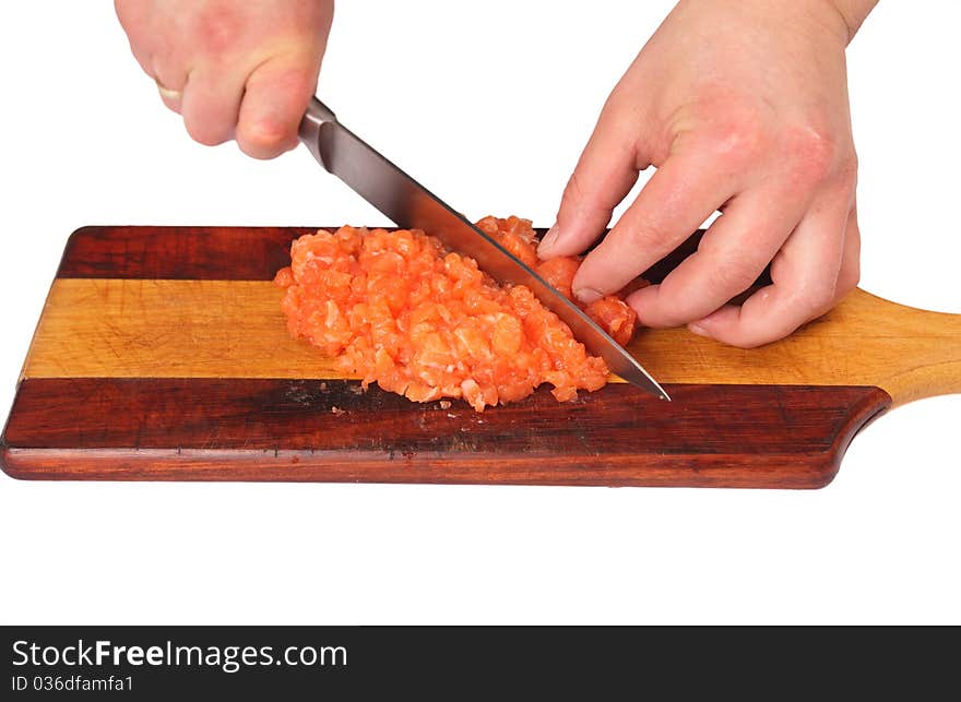 Cook cutting fresh salmon fillet. Cook cutting fresh salmon fillet