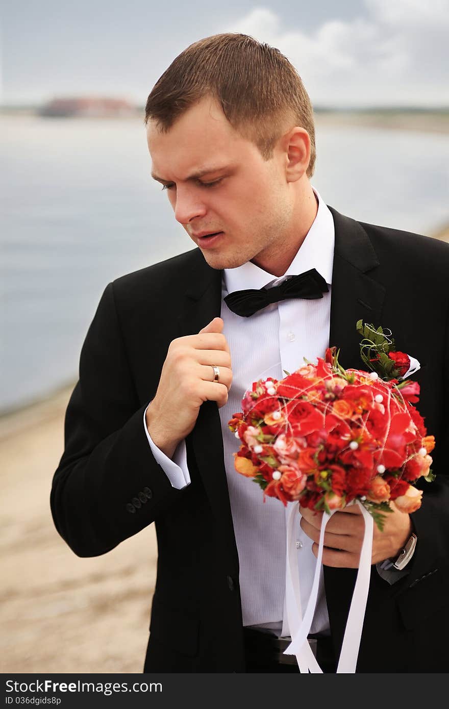 Portrait of young fiance near the river