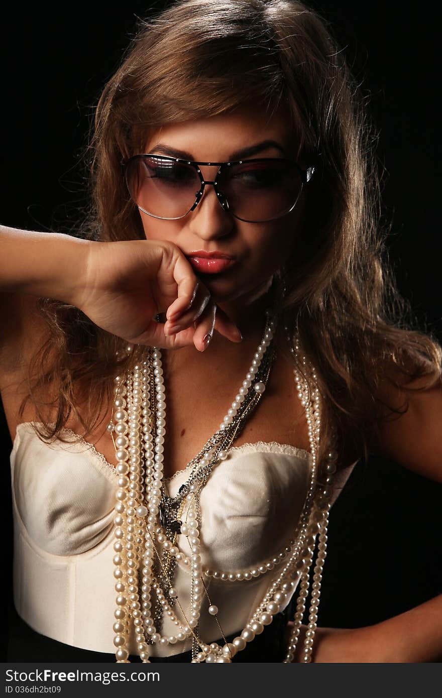 Close-up portrait of foxy looking beauty in sunglasses